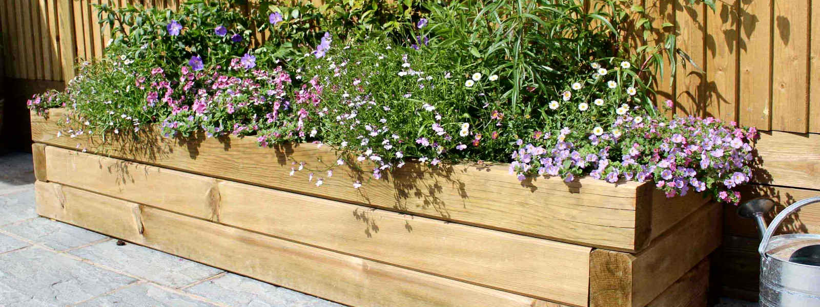 Raised timber planter constructed by buzzcut